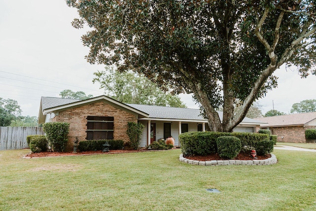 ranch-style house featuring a front lawn