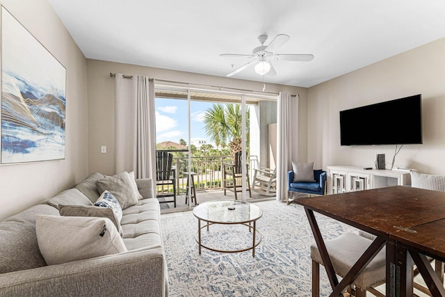 living area with a ceiling fan