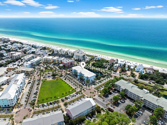 aerial view with a water view and a view of the beach