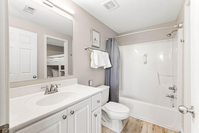 full bathroom with wood-type flooring, vanity, toilet, and shower / bath combination with curtain