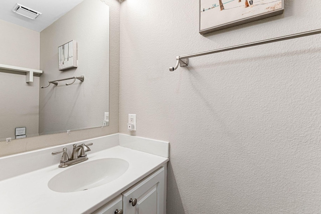 bathroom with visible vents and vanity