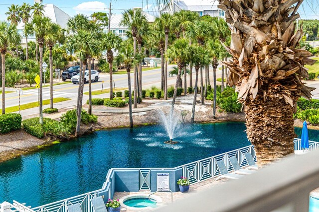 view of pool featuring a water view