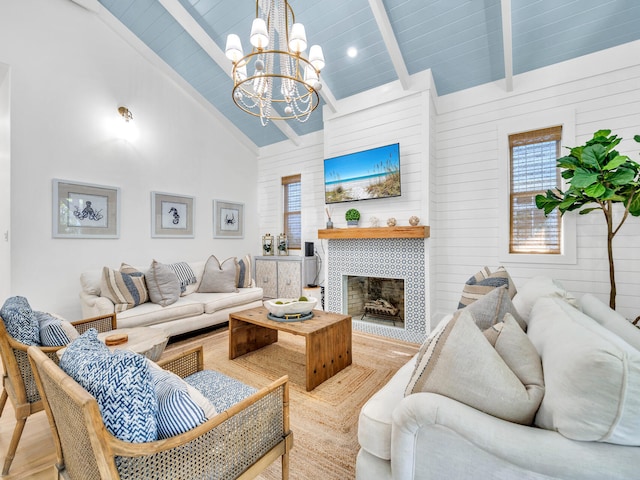 147 Silver Laurel Way, Santa Rosa Beach, FL 32459 - living room featuring an inviting chandelier, beam ceiling, wood finished floors, a fireplace, and high vaulted ceiling