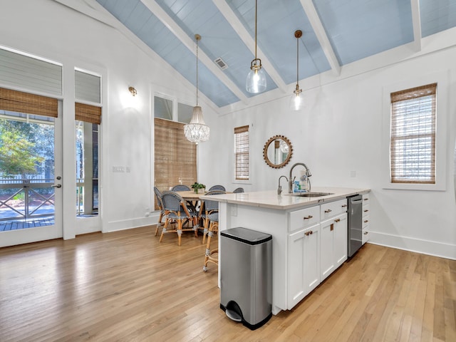 147 Silver Laurel Way, Santa Rosa Beach, FL 32459 - kitchen featuring stainless steel dishwasher, lofted ceiling with beams, a sink, and a healthy amount of sunlight