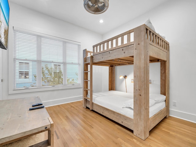 bedroom with hardwood / wood-style flooring