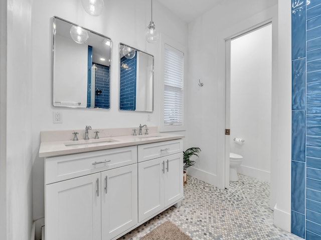 bathroom featuring vanity, toilet, and tile patterned floors