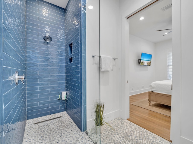 147 Silver Laurel Way, Santa Rosa Beach, FL 32459 - ensuite bathroom featuring recessed lighting, a tile shower, wood finished floors, and ensuite bath