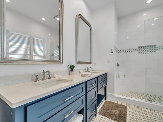 147 Silver Laurel Way, Santa Rosa Beach, FL 32459 - bathroom with double vanity, tiled shower, a sink, and recessed lighting