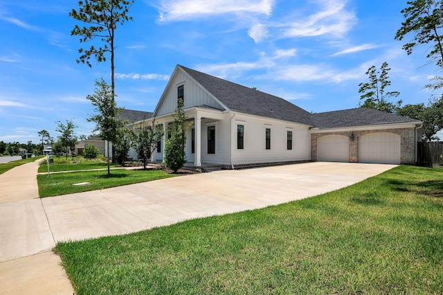 view of front of house with a garage and a front lawn