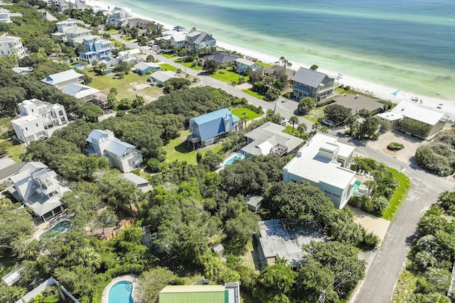 birds eye view of property featuring a water view and a view of the beach