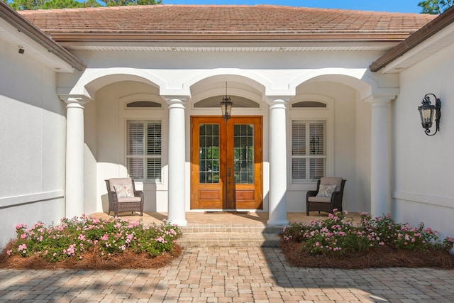 view of exterior entry featuring french doors