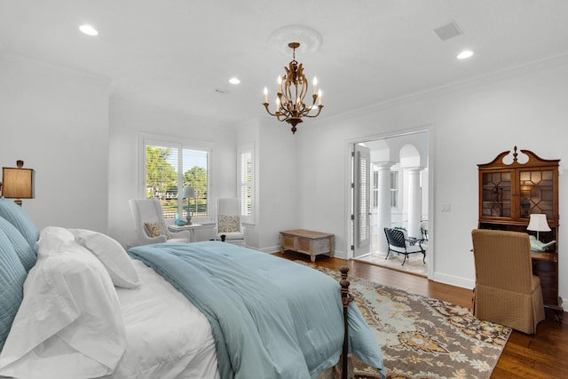 bedroom with decorative columns, a notable chandelier, crown molding, and dark hardwood / wood-style flooring