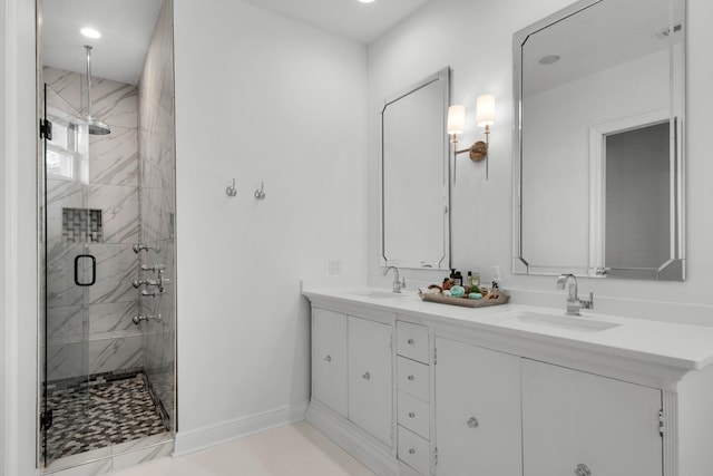 bathroom featuring vanity and a shower with shower door