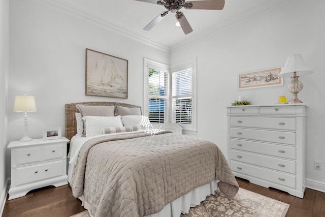 bedroom featuring ornamental molding, ceiling fan, and dark wood-type flooring