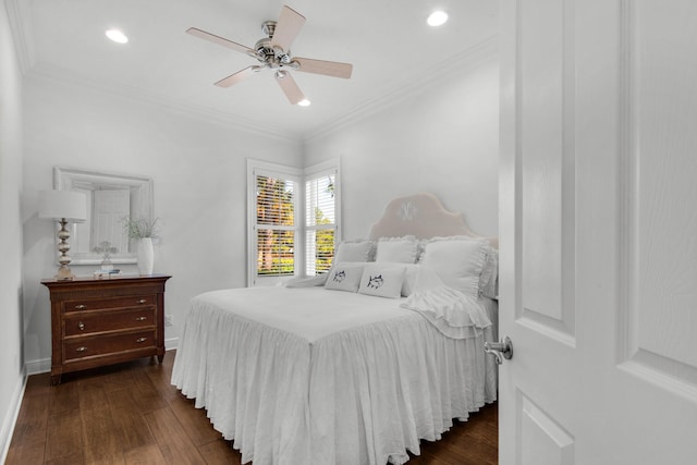 bedroom featuring crown molding, dark hardwood / wood-style flooring, and ceiling fan