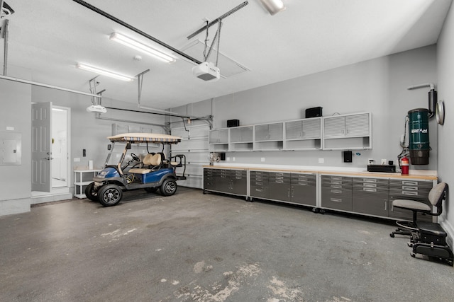 garage featuring a garage door opener and electric panel