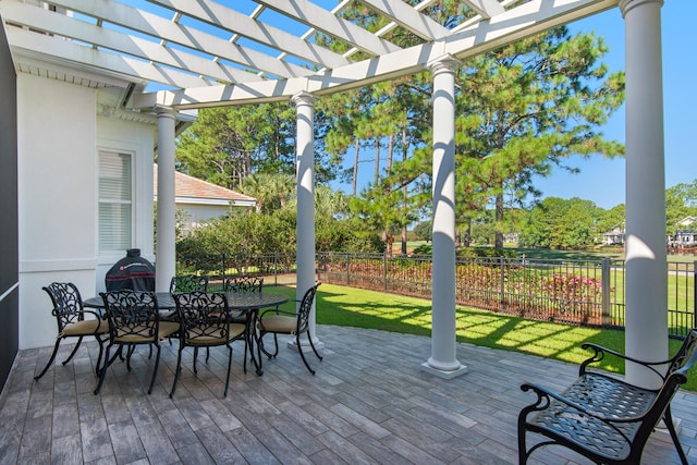 wooden terrace with a pergola and a yard