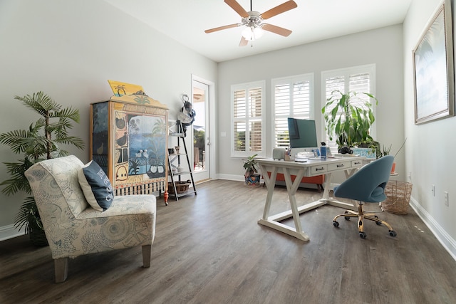 home office with a wealth of natural light, hardwood / wood-style flooring, and ceiling fan