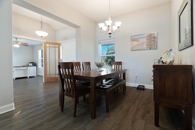 dining room featuring lofted ceiling, dark wood-type flooring, and ceiling fan with notable chandelier