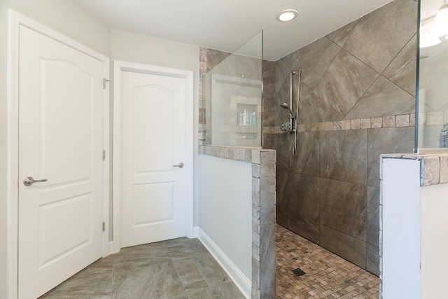 bathroom featuring tiled shower