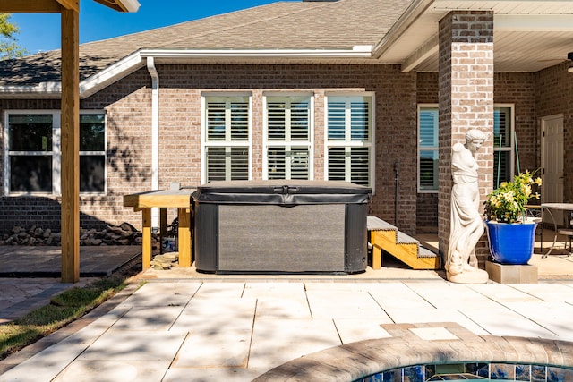 view of patio with a hot tub