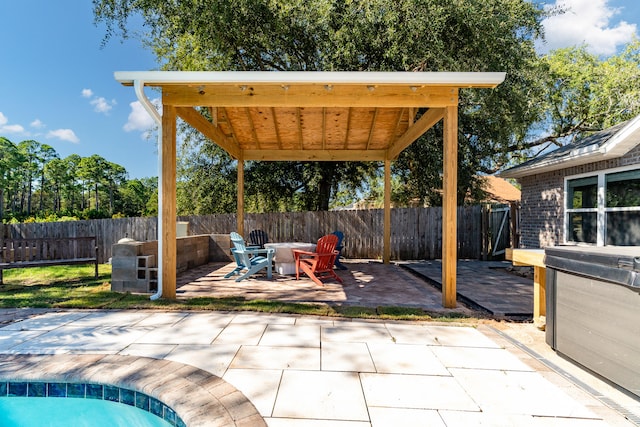 view of patio / terrace featuring a swimming pool