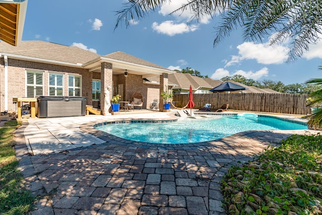 view of pool with a hot tub, a patio area, and ceiling fan