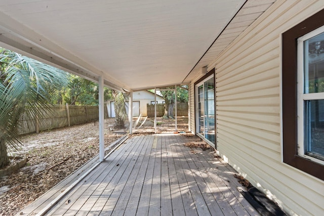 wooden terrace with a shed