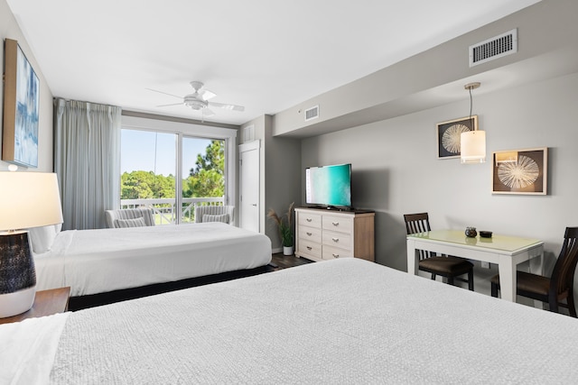 bedroom featuring wood-type flooring, access to outside, and ceiling fan