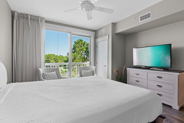 bedroom with ceiling fan and dark wood-type flooring