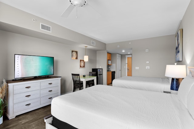 bedroom featuring ceiling fan and dark hardwood / wood-style flooring