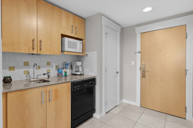 kitchen with light tile patterned flooring, tasteful backsplash, sink, dishwasher, and light stone countertops