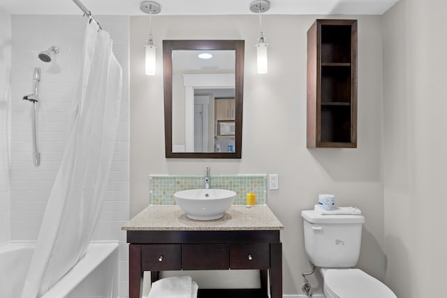 full bathroom featuring shower / bath combination with curtain, vanity, and toilet