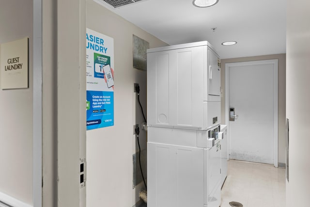 laundry area featuring stacked washer and clothes dryer