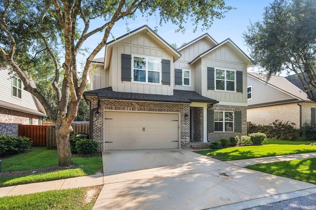 craftsman-style house featuring a garage and a front lawn