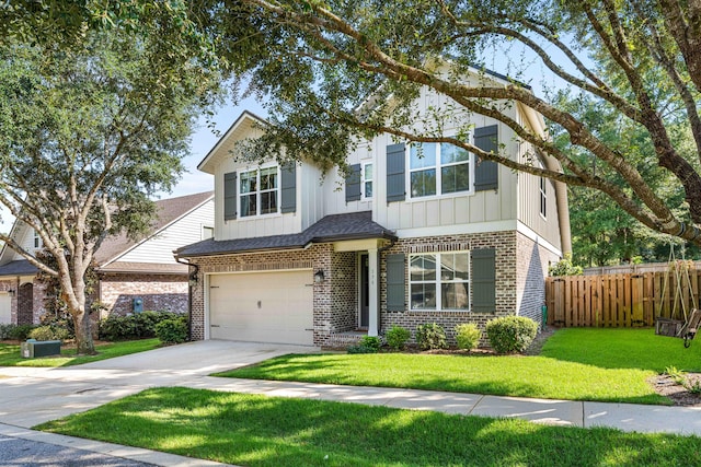 view of front of home with a garage and a front yard