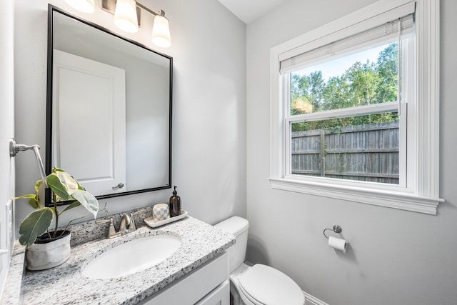 bathroom featuring vanity and toilet