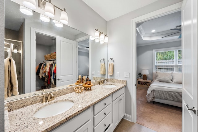 bathroom featuring ceiling fan, vanity, and crown molding