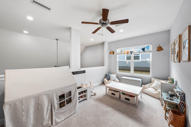 sitting room with light carpet and ceiling fan