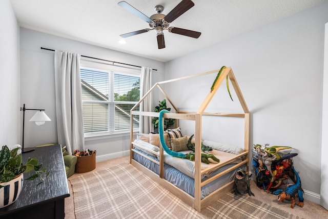 carpeted bedroom featuring ceiling fan