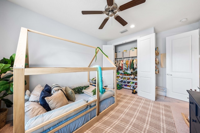 bedroom with ceiling fan and light colored carpet