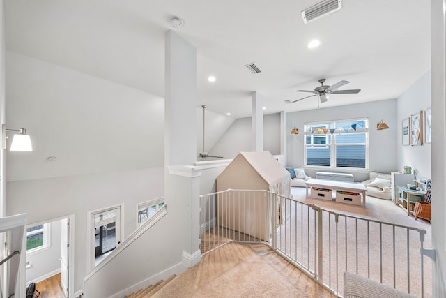 washroom with light wood-type flooring and ceiling fan