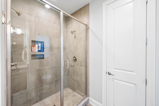 bathroom with an enclosed shower