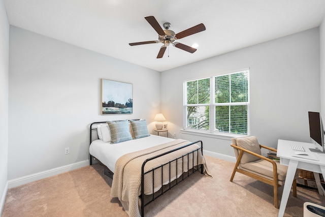 bedroom with ceiling fan and light colored carpet