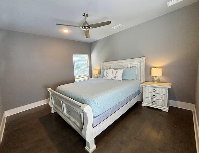 bedroom featuring ceiling fan and dark hardwood / wood-style floors