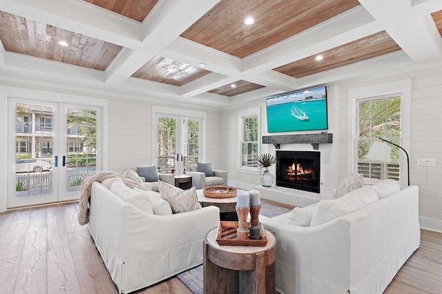 living room with wood ceiling, light hardwood / wood-style floors, beamed ceiling, coffered ceiling, and wooden walls