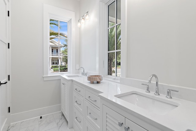 bathroom with vanity and a healthy amount of sunlight