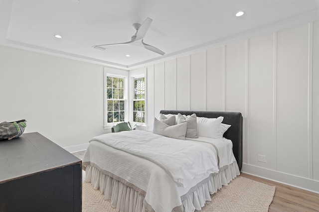 bedroom featuring light hardwood / wood-style floors and ceiling fan