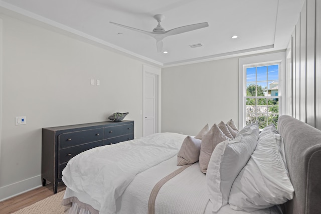 bedroom with hardwood / wood-style floors and ceiling fan