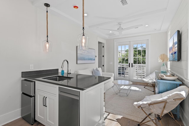 kitchen with sink, french doors, decorative light fixtures, white cabinetry, and dark hardwood / wood-style flooring